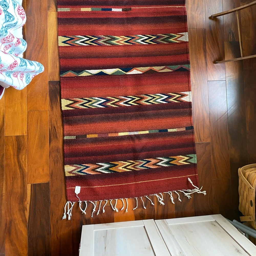 Oaxaca woven wool rug, organic dye,
used briefly, has original tag.